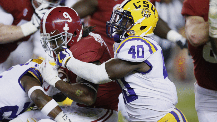 Alabama running back Bo Scarbrough is tackled by LSU linebacker Devin White during the first half of an NCAA college football game, Saturday, Nov. 4, 2017, in Tuscaloosa, Ala. (AP Photo/Brynn Anderson)