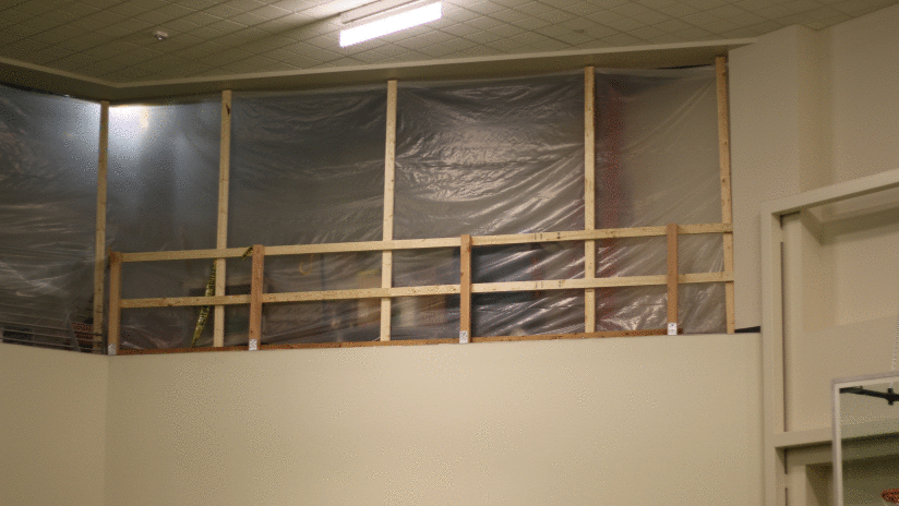 The catwalk above the weight room is shrouded in construction.