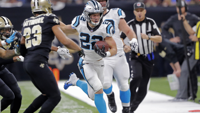 Carolina Panthers running back Christian McCaffrey (22) carries against New Orleans Saints cornerback Marshon Lattimore (23) in the first half of an NFL football game in New Orleans, Sunday, Dec. 30, 2018. (AP Photo/Gerald Herbert)