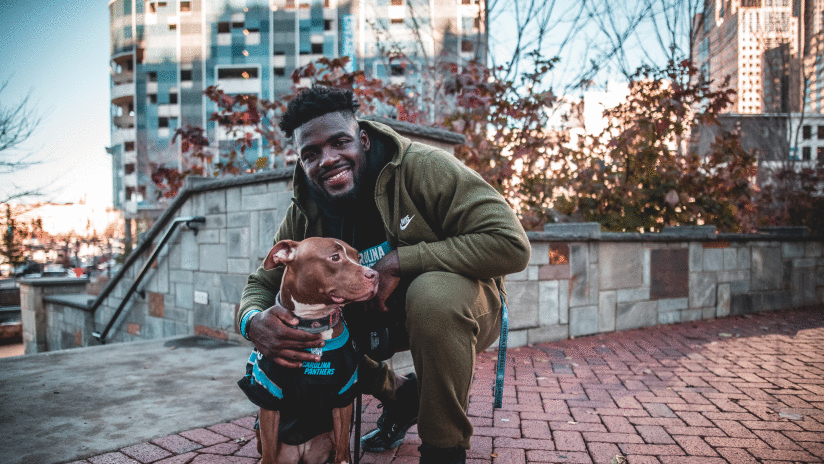 View photos of linebacker Andre Smith with his dog, Rose, at Romare Bearden park in Charlotte.