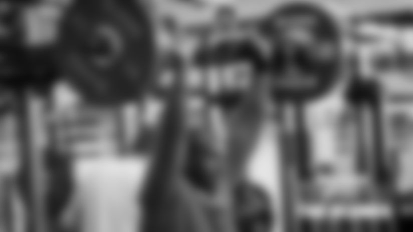 From signing memorabilia to hitting the weight room, take a look at the work Bears players put in off the field during Organized Team Activities.