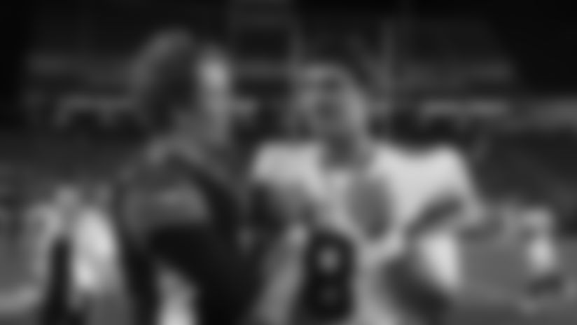 Cincinnati Bengals quarterback Ryan Finley (5) meets with New York Giants quarterback Daniel Jones (8) after an NFL preseason football game Thursday, Aug. 22, 2019, in Cincinnati. (AP Photo/Gary Landers)