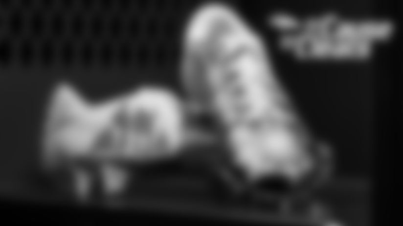 Phillip Lindsay's cleats for Urban Peak