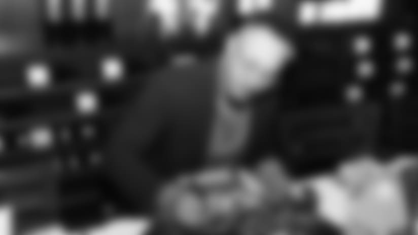 Shane Ray signs some memorabilia during Shane Ray's 2nd Annual Rays Awareness Steak Dinner at 801 Chophouse in Denver on November 12, 2018.