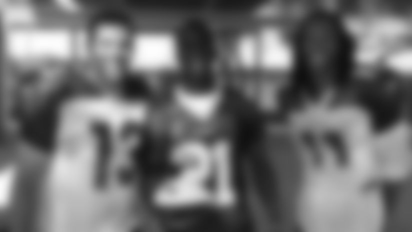 Prince Amukamara of Glendale Apollo High School gets a High School Player of the Week award in September of 2006 from Kurt Warner and Larry Fitzgerald.