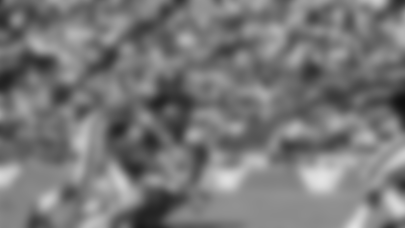Dallas Cowboy quarterback Don Meredith (17) is tackled after an 8-yard run in the second quarter of Sunday's game at the Cotton Bowl against the New York Giants September 24, 1967. Making the tackle are Giant Linebackers Bill Swain (52) and Vince Costello (57). Meredith led the cowboys to a 38-24 victory over the Giants. (AP Photo)