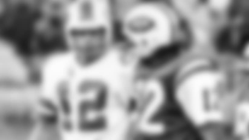 New York Jets quarterback Joe Namath, right, and Buffalo Bills quarterback Joe Ferguson, have each other's numbers as they walk off the field at New York's Shea Stadium in New York after the Bills squeaked through with the 24-23 victory, Nov. 2, 1975. (AP Photo/Ray Stubblebine)