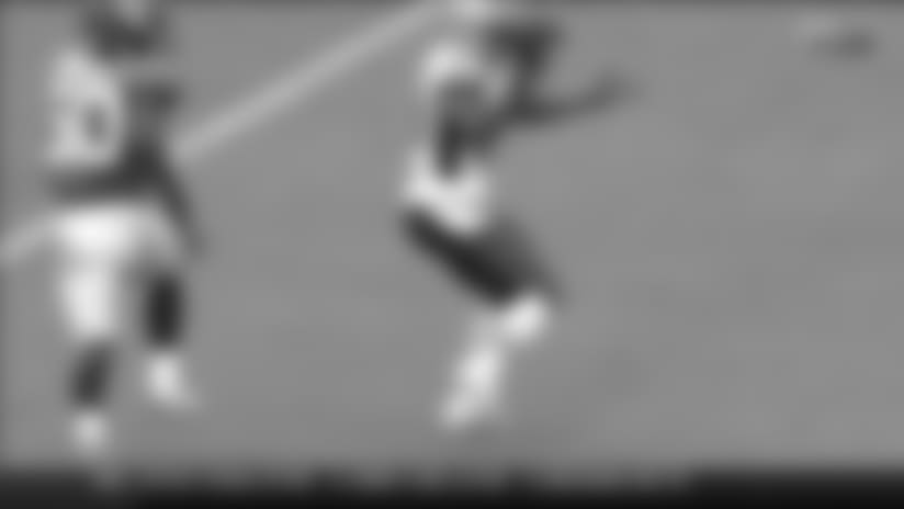 Dorsett almost turns completely around to haul in catch