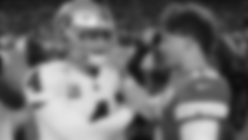 Kansas City Chiefs quarterback Patrick Mahomes (15) and Oakland Raiders quarterback Derek Carr (4) greet each other after their NFL football game Sunday, Dec. 30, 2018, in Kansas City, Mo. Kansas City won 35-3. (AP Photo/Charlie Riedel)