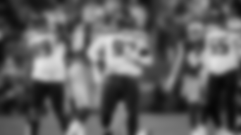 Seahawks defensive tackle Poona Ford rubs his belly after a tackle for loss in overtime.
