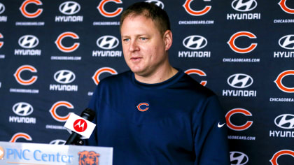 Chicago Bears offensive coordinator Luke G , left, talks to