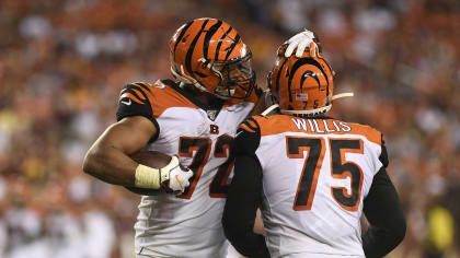 A.J. Green of the Cincinnati Bengals adjusts his face mask before