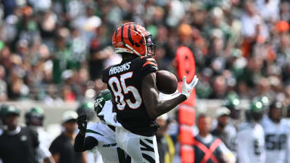 Cincinnati Bengals quarterback Joe Burrow (9) checks on Tee Higgins (85)  after Higgins was hurt on a play during the first half of an NFL football  game against the New York Jets