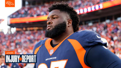 Denver Broncos defensive tackle D.J. Jones (97) speaks with Denver Broncos  defensive tackle Mike Purcell (98) during a practice session in Harrow,  England, Thursday, Oct. 27, 2022. The Denver Broncos will play