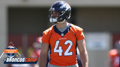 Denver Broncos long snapper Jacob Bobenmoyer walks off the field