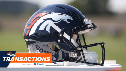 Denver Broncos' Shaun Beyer smiles while on the bench against the Seattle  Seahawks during the second half of an NFL football preseason game,  Saturday, Aug. 21, 2021, in Seattle. The Broncos won