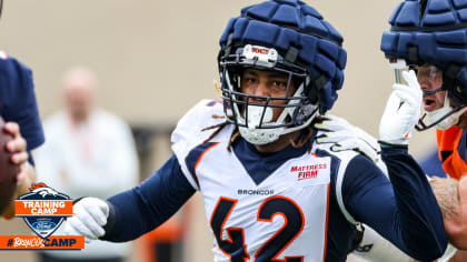 Denver Broncos linebacker Nik Bonitto walks off the field after a