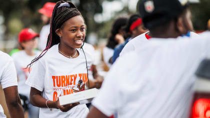 Miami Dolphins score within the community with Annual Thanksgiving  Distribution