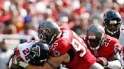 Ashley Lelie of the Atlanta Falcons holds the ball before the game