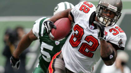 Quarterback Vinny Testaverde of the New York Jets is tackled by