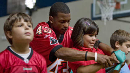 Bucs player gives autographed game jersey to local girl