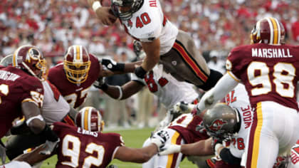 Tampa Bay Buccaneers great Mike Alstott's first game jersey, left, along  side of his last game jersey, are displayed during a special tribute during  the half time of an NFL football game