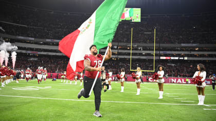 Arizona Cardinals guard Will Hernandez (76) wears a Mexico flag