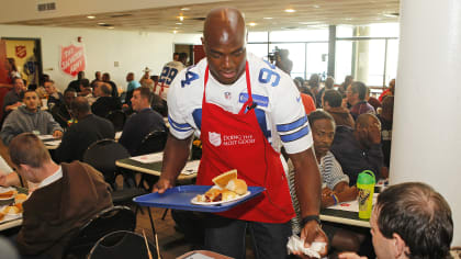 The Dallas Cowboys serve an early Thanksgiving meal at Salvation Army 