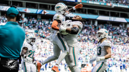 The Miami Dolphins celebrate after scoring a touchdown during the