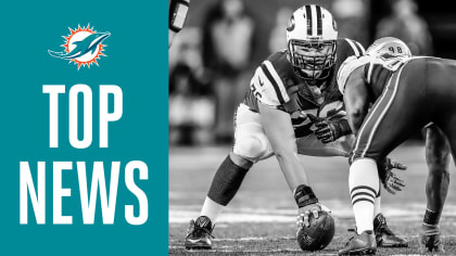 Dolphins sign OL Wesley Johnson, promote DE Cameron Malveaux from