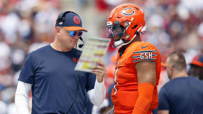 CHICAGO, IL - AUGUST 09: Chicago Bears quarterback Justin Fields (1) runs  out during introductions before the Chicago Bears training camp Family Fest  Day on August 9, 2022 at Soldier Field in