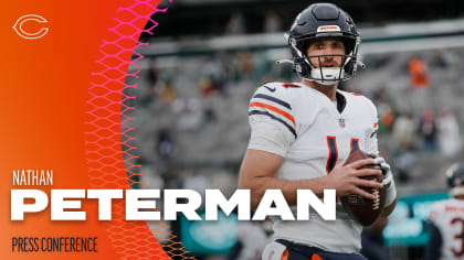 Chicago Bears quarterback Nathan Peterman (14) scrambles under