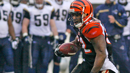 Cincinnati Bengals running back Rudi Johnson points to a group of