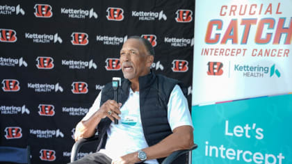 The words 'Crucial Catch Intercept Cancer' are inscribed on a sideline  banner before a NFL football game between the Baltimore Ravens and the  Cincinnati Bengals, Sunday, Oct. 9, 2022, in Baltimore. (AP