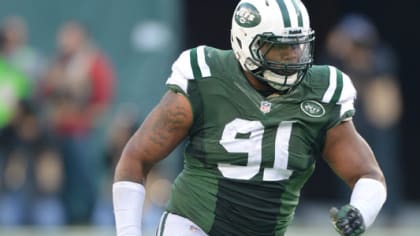 Sheldon Richardson, defensive tackle from Missouri, holds up a Jets