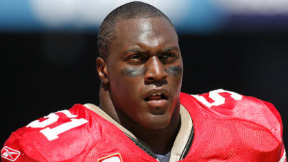 Buffalo Bills linebacker Takeo Spikes adjusts his head-band during