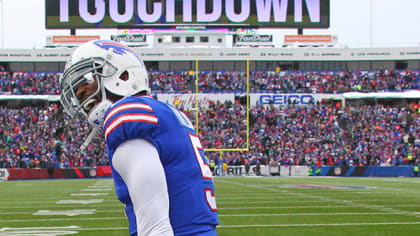 Buffalo Bills defensive tackle Kyle Williams (95) congratulates tight end  Nick O'Leary (84), after O'Leary scored a touchdown, during the first half  of an NFL football game against the Miami Dolph …