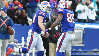 Buffalo Bills defensive tackle Kyle Williams (95) congratulates tight end  Nick O'Leary (84), after O'Leary scored a touchdown, during the first half  of an NFL football game against the Miami Dolph …