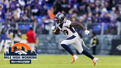 Denver Broncos wide receiver Brandon Johnson (89) runs with the ball past  Miami Dolphins cornerback Kader