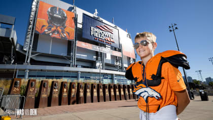 View of dog wearing Denver Broncos jersey in parking lot outside Mile  News Photo - Getty Images