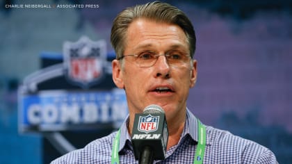 George Paton, general manager of the Denver Broncos, responds to questions  during a news conference on media day before the team officially opens an  NFL football training camp at Broncos headquarters Tuesday