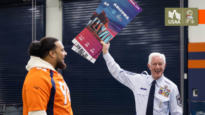 Denver Broncos defensive tackle D.J. Jones (97) speaks with Denver Broncos  defensive tackle Mike Purcell (98) during a practice session in Harrow,  England, Thursday, Oct. 27, 2022. The Denver Broncos will play