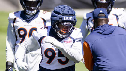 Denver Broncos wide receiver Brandon Johnson (89) runs with the ball past  Miami Dolphins cornerback Kader