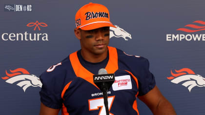 Tyler Badie of the Denver Broncos reacts after rushing for a