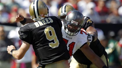 Reggie Bush, wearing a Will Smith jersey, leads Saints onto field