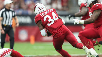 Arizona Cardinals safety Jalen Thompson (34) gives the ball to the ball boy  on the sidelines after intercepting a pass in the second half of an NFL  football game against the Carolina