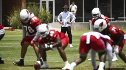 Arizona Cardinals linebacker Krys Barnes (56) hauls in an interception as  Cardinals safety Jalen Thompson (34) looks on during NFL football training  camp practice at State Farm Stadium Saturday, July 29, 2023