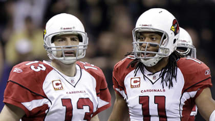 Arizona Cardinals quarterback Kurt Warner argues with a referee as Arizona  Cardinals wide receiver Larry Fitzgerald looks on in the third quarter  against the Pittsburgh Steelers at Super Bowl XLIII at Raymond