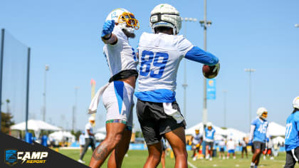 Los Angeles Chargers running back Joshua Kelley, right, is tackled by Miami  Dolphins cornerback Kader Kohou during the first half of an NFL football  game Sunday, Dec. 11, 2022, in Inglewood, Calif. (