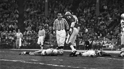 Otis Taylor of the Kansas City Chiefs, underneath, grabs Ben Davidson, on  top, of the Oakland R …